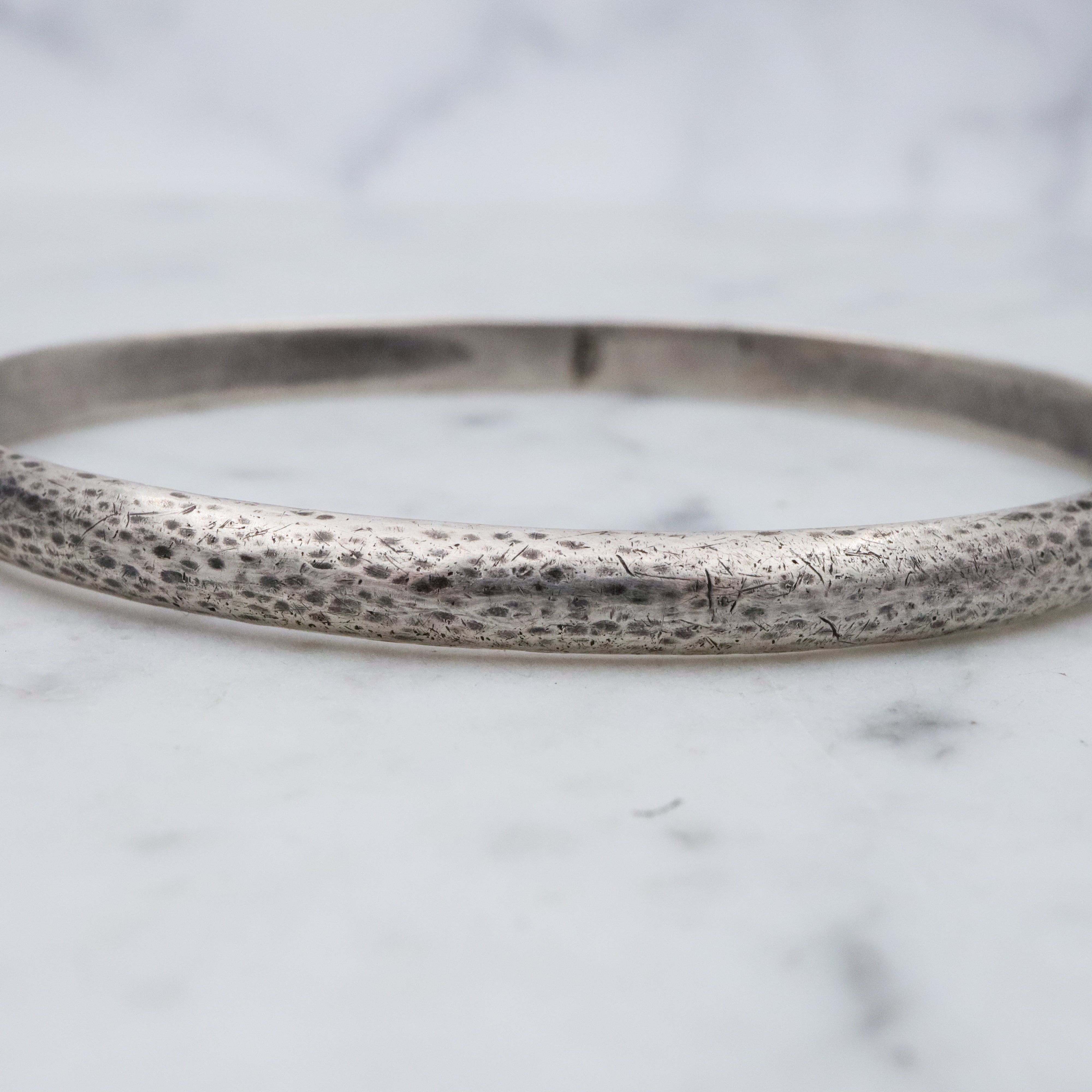 Mid Century hand hammered solid sterling oval bangle